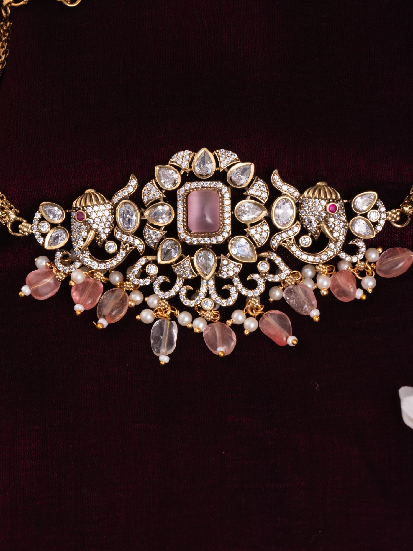 Details of victorian choker necklace in flower and elephant motifs 