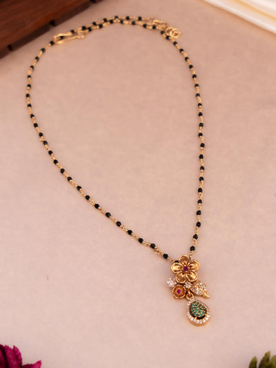 Unique brass Nallapusalu with a flower pattern pendant and CZ stones from Imperial Tara in a chain design
