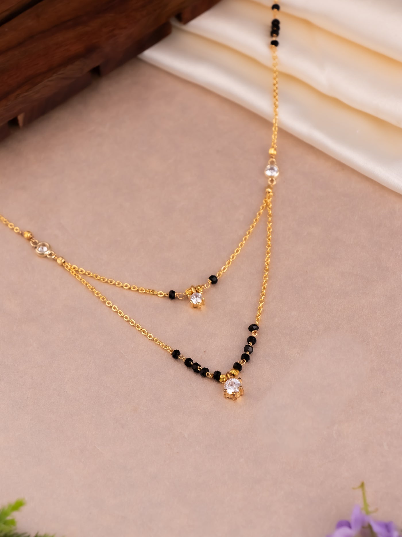 Every day minimalist chain mangalsutra with balck beads.