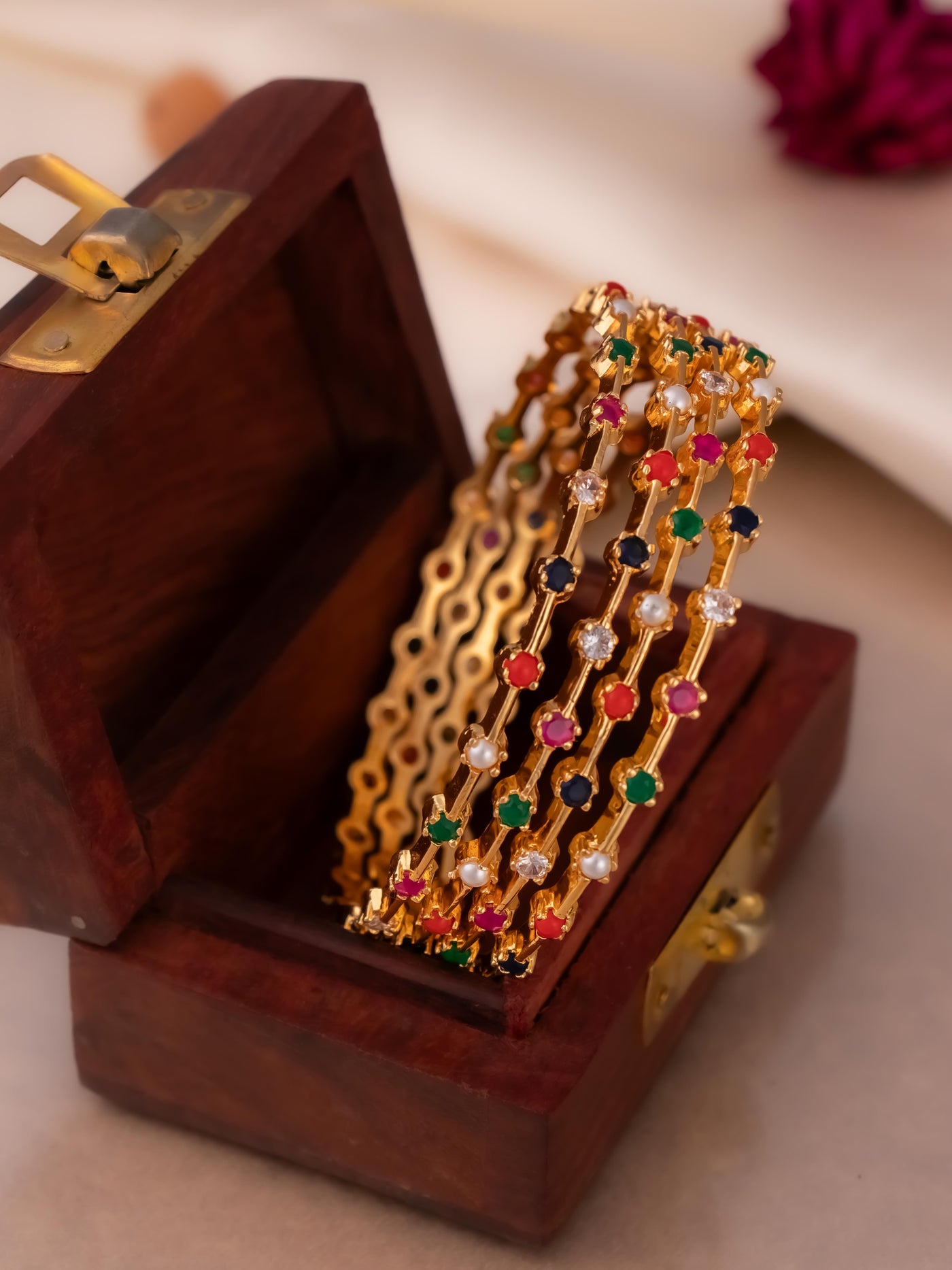 Simple four-set Navaratna bangles in gold polish at Imperial Tara

