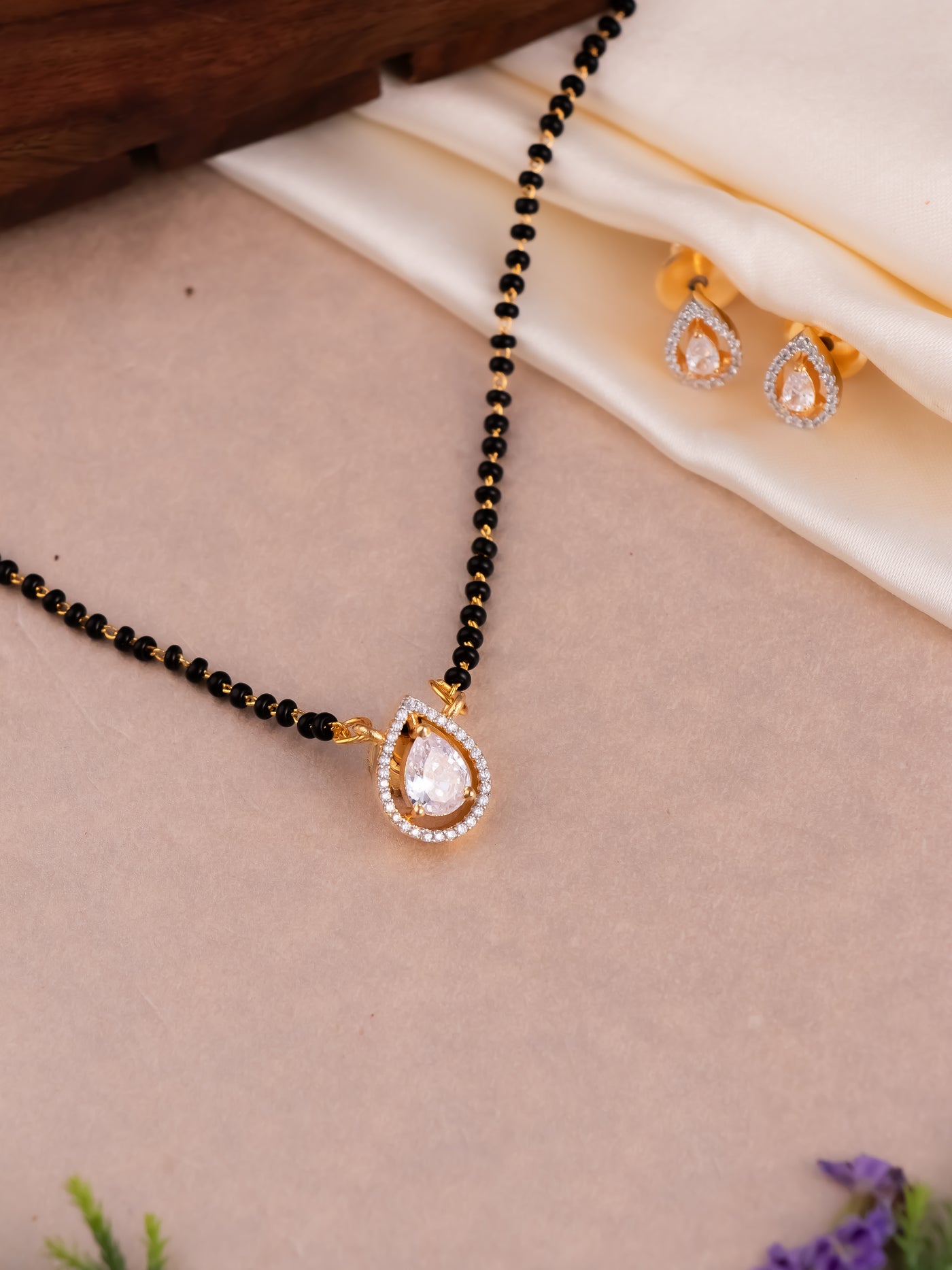 Shop delicate designer mangalsutra with pair of earrings