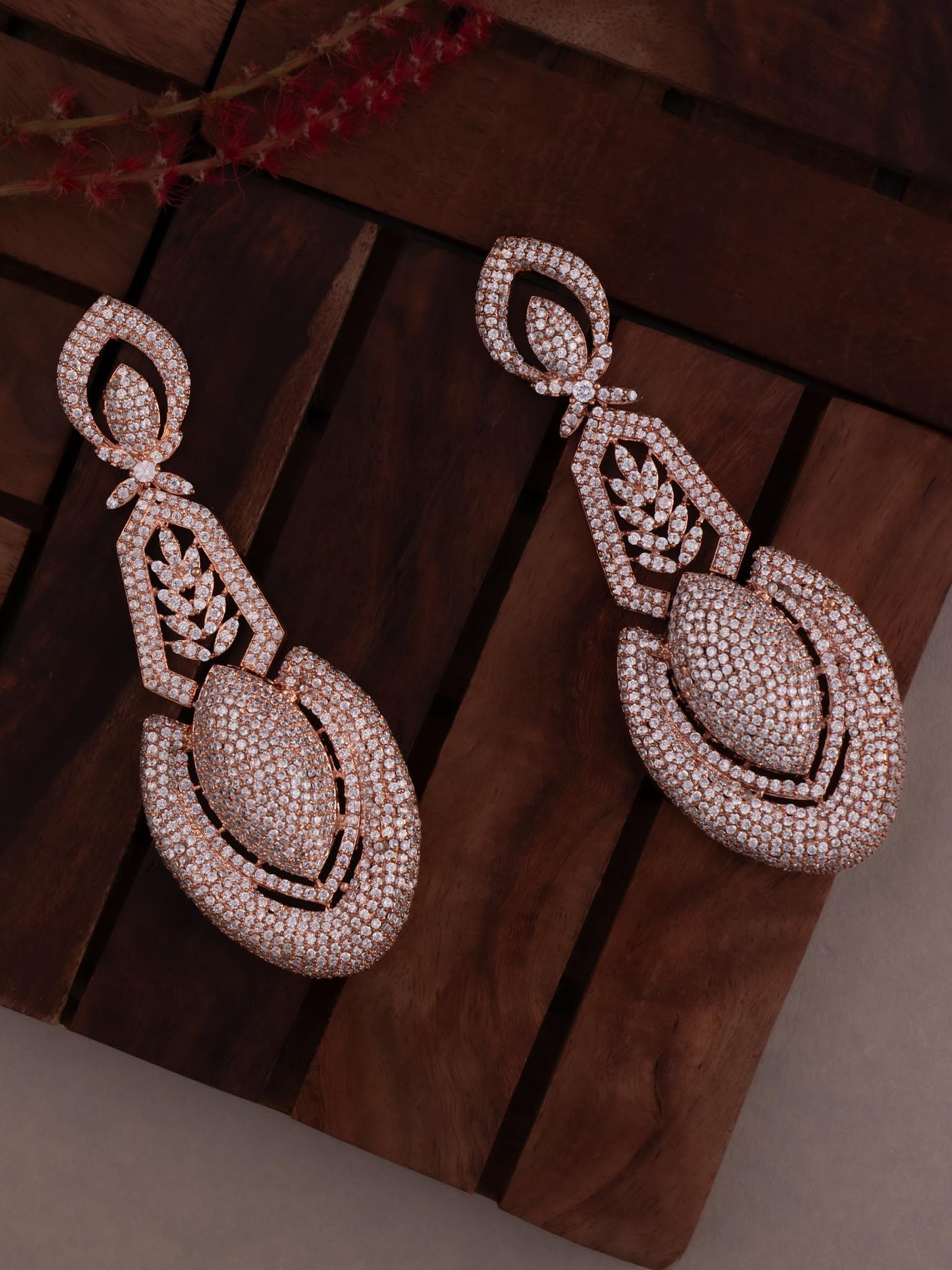 Rose gold diamond earrings in unique design.